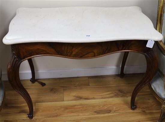 A Victorian marble topped walnut centre table, W.93cm